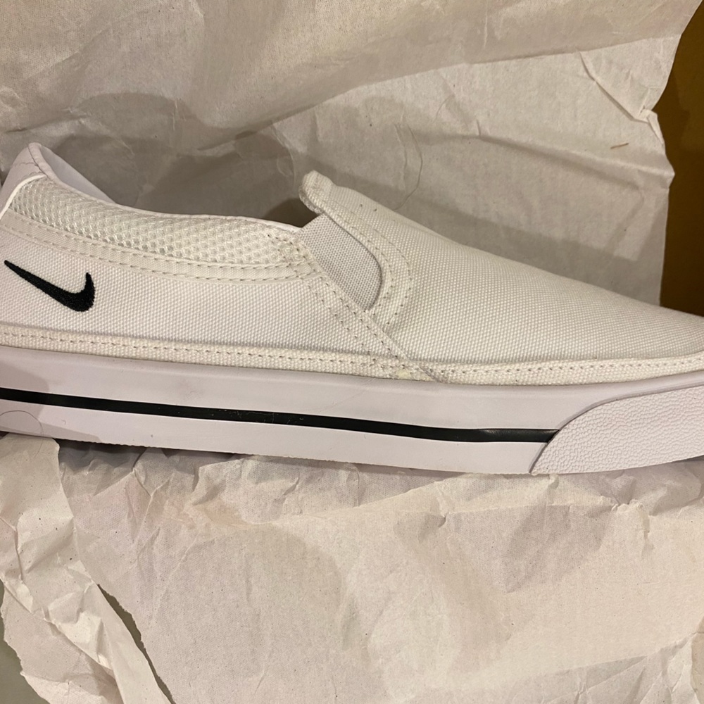 COPY - WMNs Nike Court Legacy Slip.  New but elastic side panel has one pull